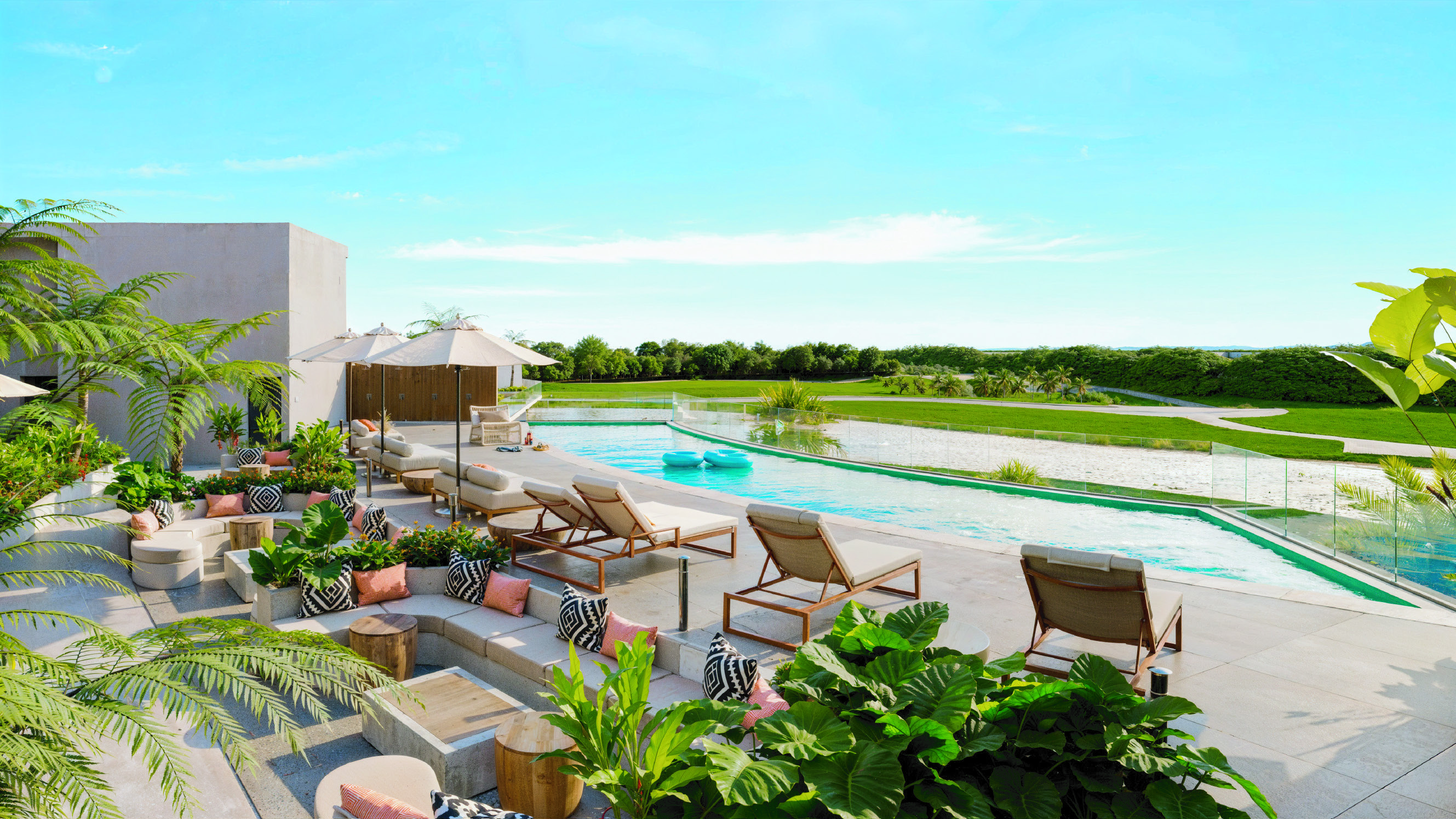 Render de la terraza con piscina, vistas al lago y campo de golf de Coral Lake